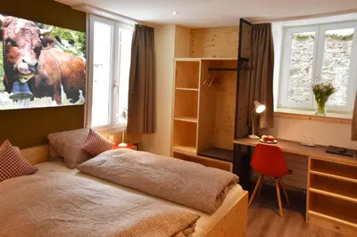 Ein Bett oder Betten in einem Zimmer der Unterkunft Eiger Guesthouse
