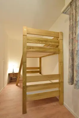Ein Bett oder Betten in einem Zimmer der Unterkunft Waldesrand Matterhorn