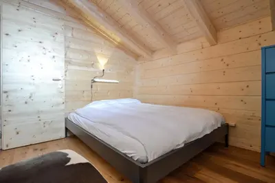 Ein Bett oder Betten in einem Zimmer der Unterkunft Hirschfluh Duplex