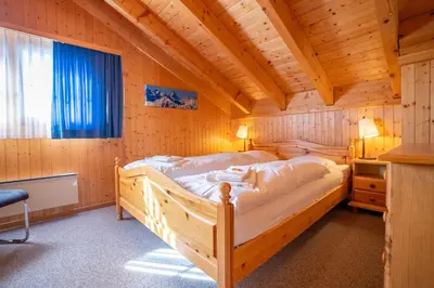 Ein Bett oder Betten in einem Zimmer der Unterkunft Chalet Collini