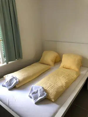 Ein Bett oder Betten in einem Zimmer der Unterkunft Villa Matten