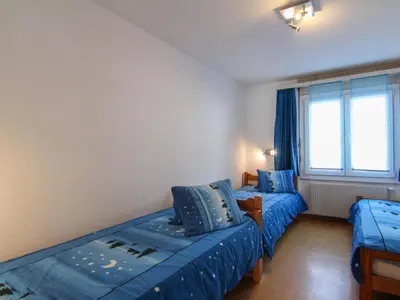 Ein Bett oder Betten in einem Zimmer der Unterkunft Apartment Casa Yolanda 1- OG Süd by Interhome