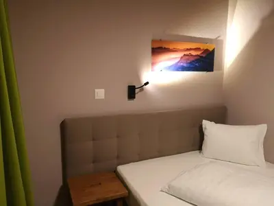 Ein Bett oder Betten in einem Zimmer der Unterkunft Blasers Hotel Restaurant Chocolat