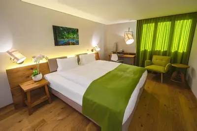 Ein Bett oder Betten in einem Zimmer der Unterkunft Blasers Hotel Restaurant Chocolat