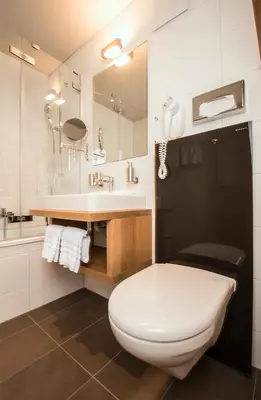Ein Badezimmer in der Unterkunft Blasers Hotel Restaurant Chocolat