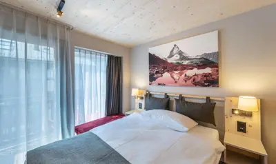Ein Bett oder Betten in einem Zimmer der Unterkunft Hotel Derby