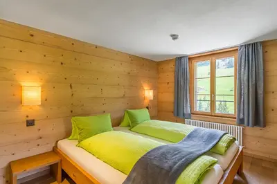 Ein Bett oder Betten in einem Zimmer der Unterkunft Hotel Des Alpes