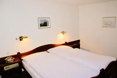 Ein Bett oder Betten in einem Zimmer der Unterkunft Hotel du Pont