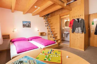 Ein Bett oder Betten in einem Zimmer der Unterkunft Hotel Alpenblick