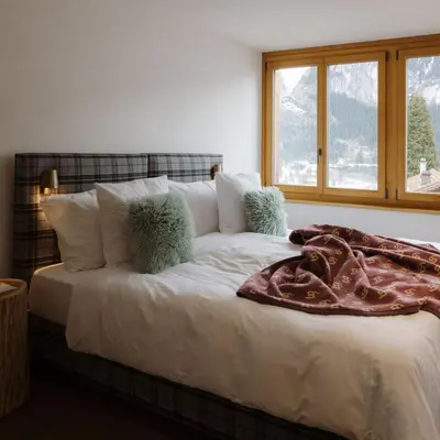Ein Bett oder Betten in einem Zimmer der Unterkunft Bergwelt Grindelwald Residence