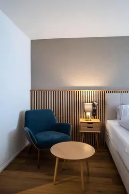 Ein Bett oder Betten in einem Zimmer der Unterkunft Hotel Viktoria Eden