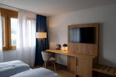 Ein Bett oder Betten in einem Zimmer der Unterkunft Hotel Viktoria Eden