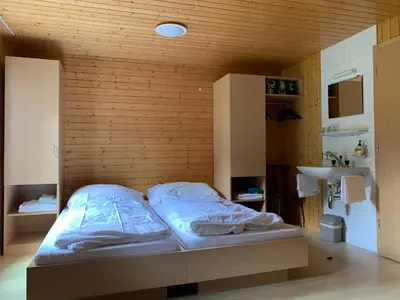 Ein Bett oder Betten in einem Zimmer der Unterkunft Pension Waldegg - restaurant