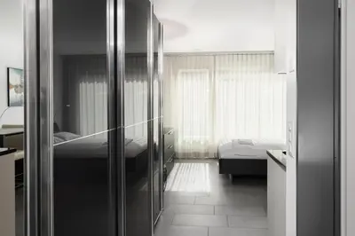 Ein Bett oder Betten in einem Zimmer der Unterkunft Studio NATASCHA Interlaken