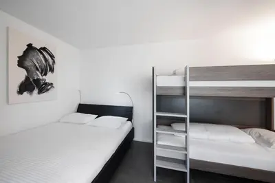 Ein Bett oder Betten in einem Zimmer der Unterkunft Studio RAFAEL Interlaken