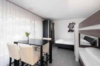 Ein Bett oder Betten in einem Zimmer der Unterkunft Studio VICTORIA Interlaken