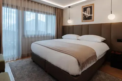 Ein Bett oder Betten in einem Zimmer der Unterkunft Boutique Hotel PANORAMA Crans-Montana