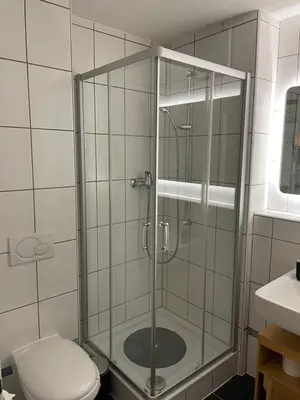 Ein Badezimmer in der Unterkunft Super central - appartement 2,5pcs à Leukerbad