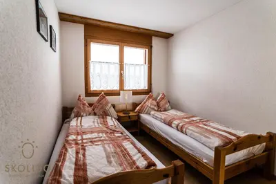 Ein Bett oder Betten in einem Zimmer der Unterkunft Haus Lotus, Riederalp Moosfluhbahn