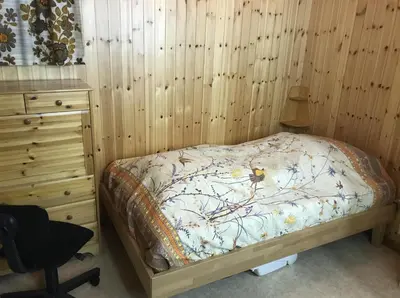 Ein Bett oder Betten in einem Zimmer der Unterkunft Ferienwohnung im Chalet Boubou