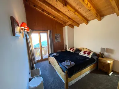 Ein Bett oder Betten in einem Zimmer der Unterkunft K2 Chalet