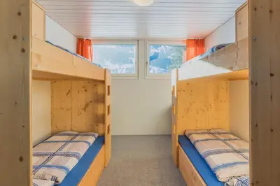 Ein Bett oder Betten in einem Zimmer der Unterkunft Mountain Lodge Backpackercamp