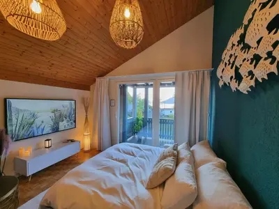 Ein Bett oder Betten in einem Zimmer der Unterkunft Fischerhüsli directly on lake Thun