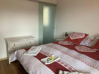 Ein Bett oder Betten in einem Zimmer der Unterkunft La Jacinthe de Crans