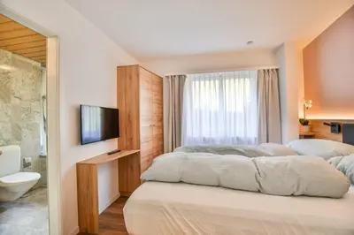 Ein Bett oder Betten in einem Zimmer der Unterkunft Valaisia 125