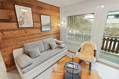 Ein Sitzbereich in der Unterkunft Appartement en plein centre de Crans Montana