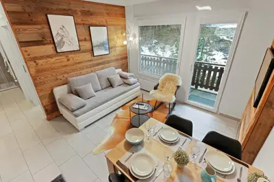 Ein Sitzbereich in der Unterkunft Appartement en plein centre de Crans Montana