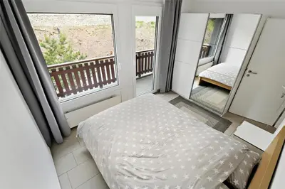 Ein Bett oder Betten in einem Zimmer der Unterkunft Appartement en plein centre de Crans Montana
