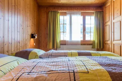 Ein Bett oder Betten in einem Zimmer der Unterkunft Chalet Sunnegga