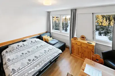 Ein Bett oder Betten in einem Zimmer der Unterkunft Studio cosy au centre de Crans-Montana (1-4 personnes)