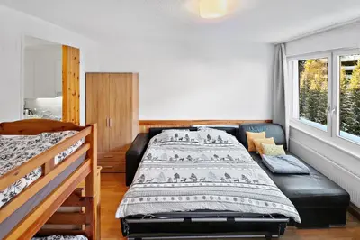 Ein Bett oder Betten in einem Zimmer der Unterkunft Studio cosy au centre de Crans-Montana (1-4 personnes)