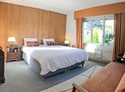 Ein Bett oder Betten in einem Zimmer der Unterkunft Between slopes and golf facing the Alps