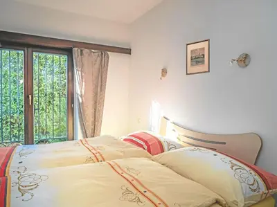 Ein Bett oder Betten in einem Zimmer der Unterkunft Avalon
