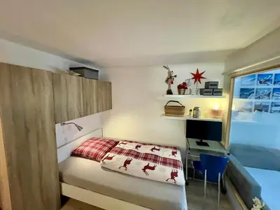Ein Bett oder Betten in einem Zimmer der Unterkunft Ferienwohnung Gemmiblick