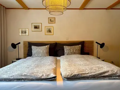 Ein Bett oder Betten in einem Zimmer der Unterkunft THE Best Valley View-Swiss Charm-Free Parking