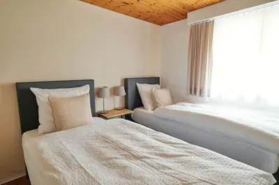 Ein Bett oder Betten in einem Zimmer der Unterkunft Ferienwohnung - 100m von der Talstation Aletsch Bahnen und Bahnhof Fiesch, BESTE Ausgangslage