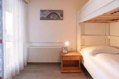 Ein Bett oder Betten in einem Zimmer der Unterkunft Apartment Jungfrau Lodge