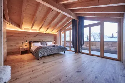 Ein Bett oder Betten in einem Zimmer der Unterkunft Attico Grindelwald