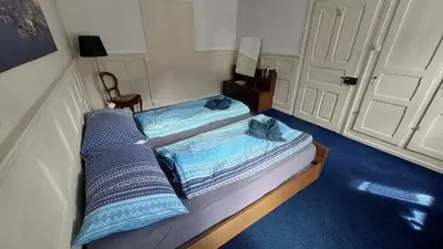 Ein Bett oder Betten in einem Zimmer der Unterkunft Ferienwohnung Rothorn Meiringen