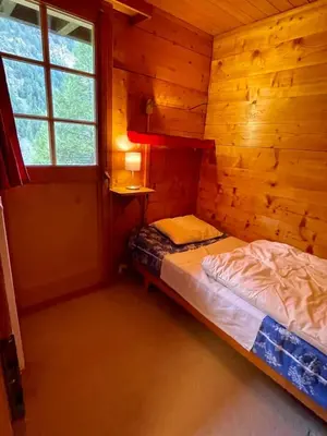 Ein Bett oder Betten in einem Zimmer der Unterkunft Chalet Singlinaz