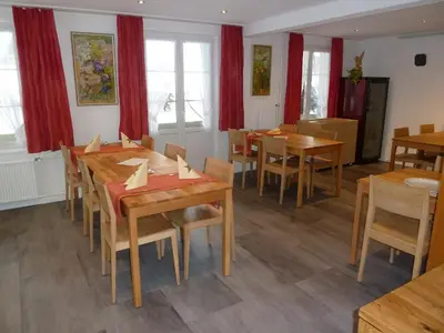 Ein Sitzbereich in der Unterkunft Hotel Restaurant Sunnmatt