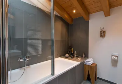 Ein Badezimmer in der Unterkunft Waldbort Penthouse