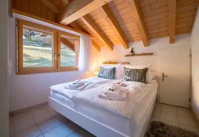 Ein Bett oder Betten in einem Zimmer der Unterkunft Chalet Rose Penthouse Residence