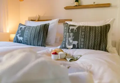 Ein Bett oder Betten in einem Zimmer der Unterkunft Chalet Rose Penthouse Residence