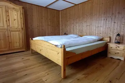 Ein Bett oder Betten in einem Zimmer der Unterkunft Känzeli - Ferienwohnung mit Traumaussicht