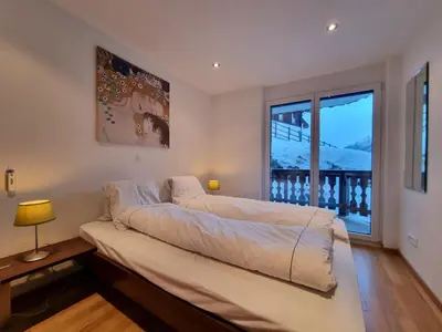 Ein Bett oder Betten in einem Zimmer der Unterkunft Mountain Village Residence